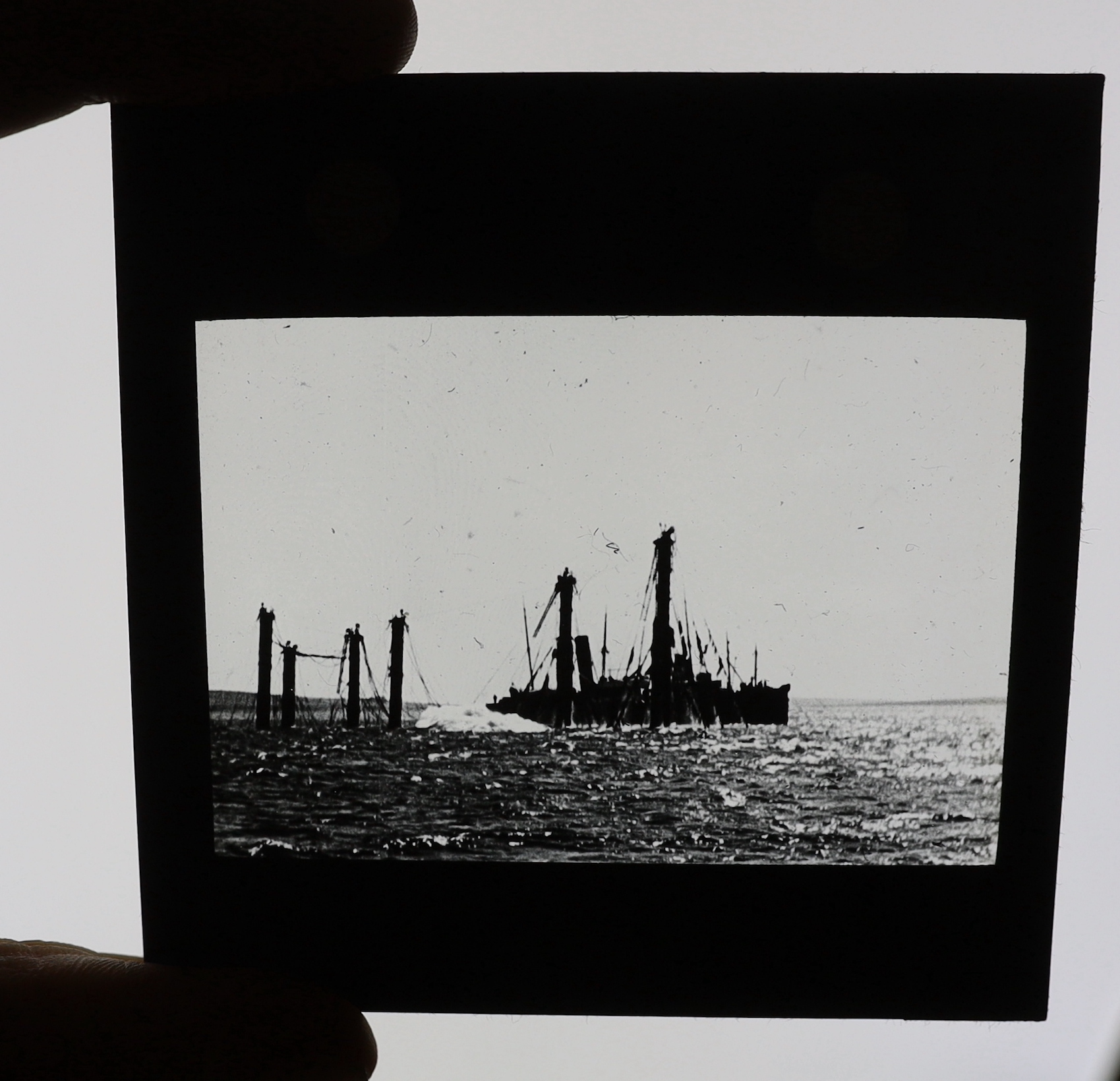 A collection of Magic Lantern boxed slides and quarter plate negatives, shipping and naval recovery